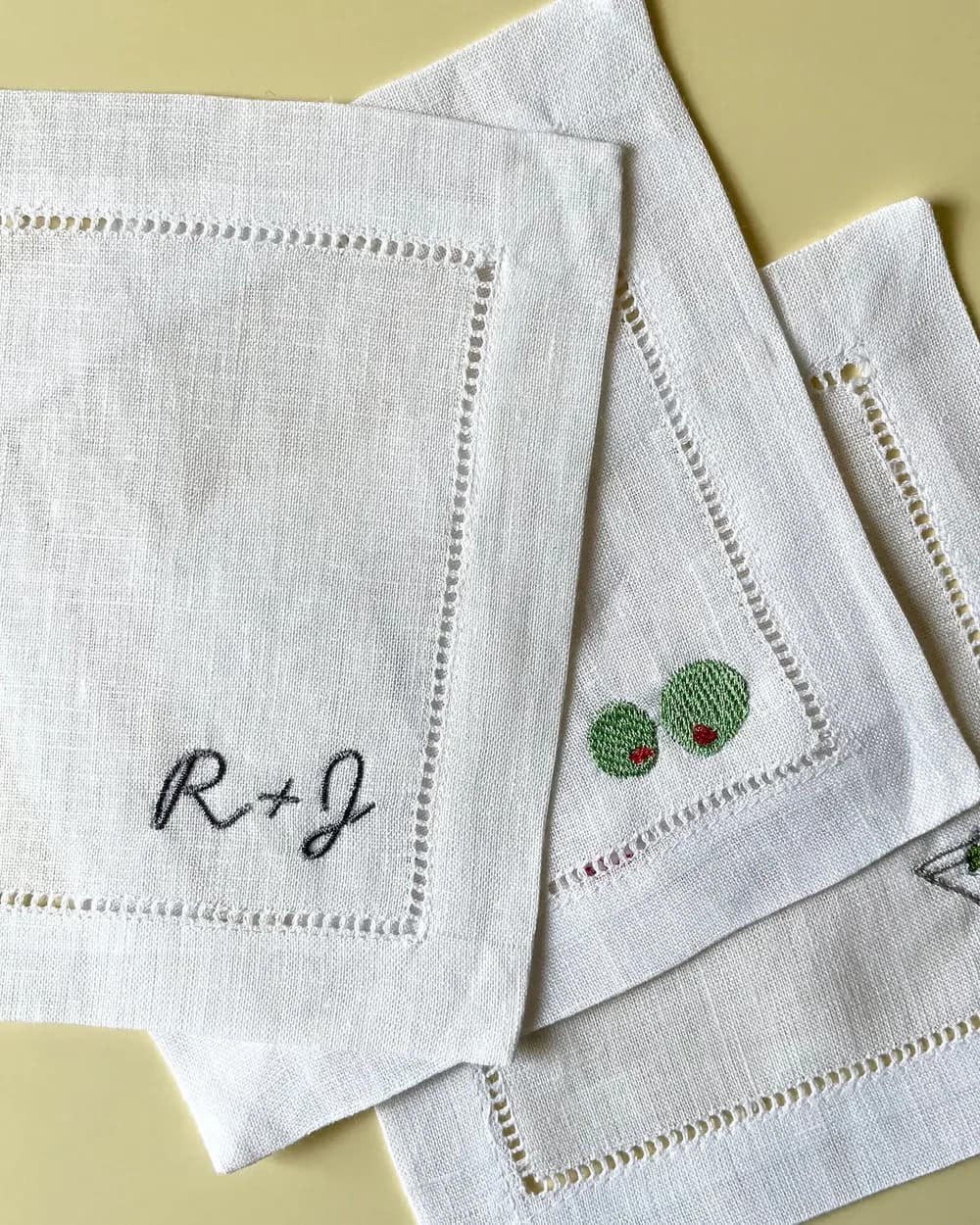 Monogrammed cocktail napkins with the initials R and J