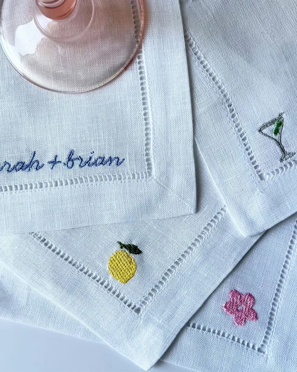 Embroidered cocktail napkins with the names Sarah and Brian