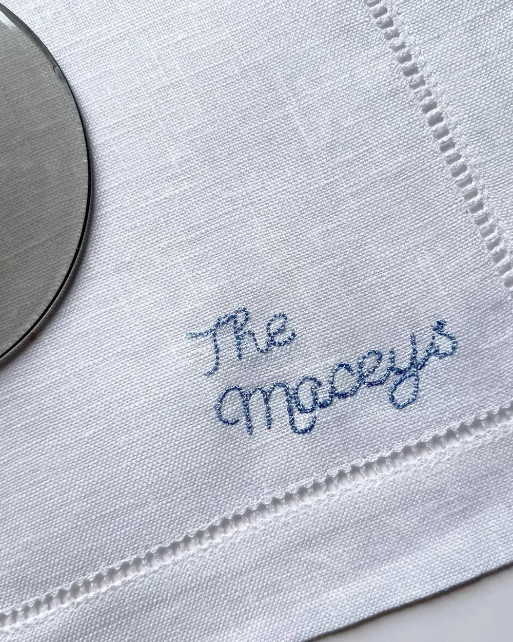 Branded cocktail napkins styled with drinks on a bar